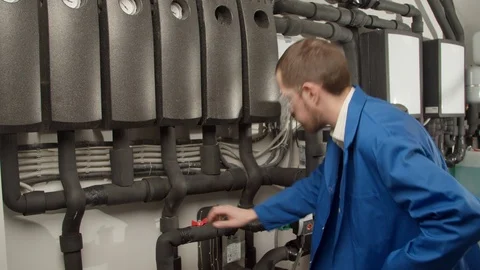 Young engineer checking new equipment Stock Footage 127175743