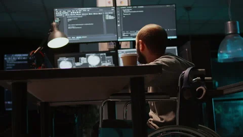 Young engineer with chronic disability working on IT software coding Stock Footage 222842377