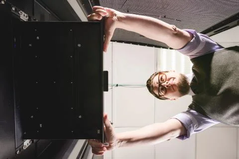 Young engineer in a datacenter Stock Photos