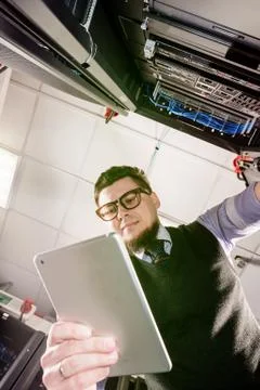 Young engineer in a datacenter Stock Photos