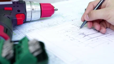 Young engineer - the designer works with the drawings Stock Footage 83198319