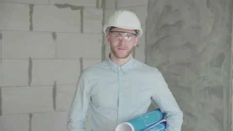  Young engineer with drawings shows like Stock Footage 133073468