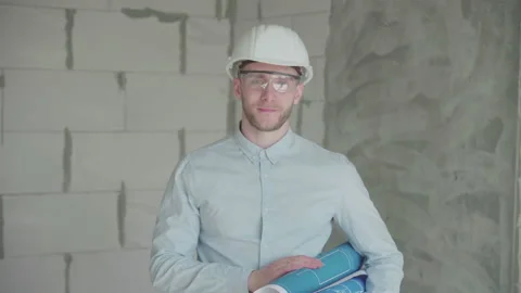  Young engineer with drawings shows like Video stock 133073603