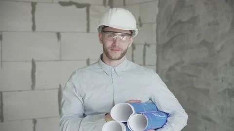  Young engineer with drawings shows like Video stock 133073776