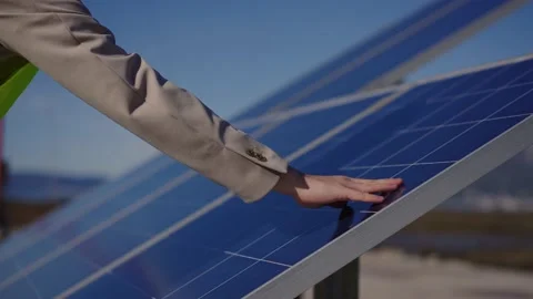 Young engineer hand is checking the operation of sun and cleanliness of Stock Footage 237400452