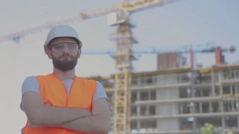 Young engineer looking at the camera and smiling close-up. Engineer on stryke Stock Footage 205376367