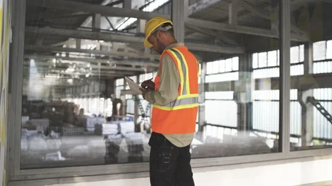 Young Engineer Man Analyzing at construction site Stock Footage 160901153