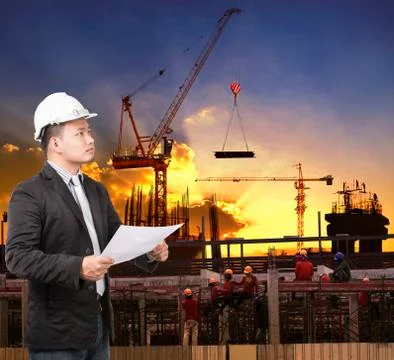 Young engineer man working with construction plan in building structure site  Stock Photos