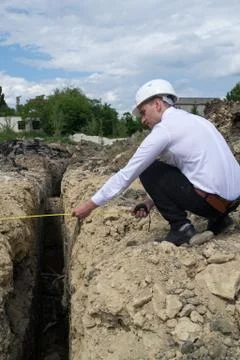 Young engineer measuring on site Stock Photos