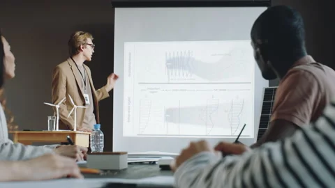 Young Engineer Presenting Renewable Energy Project to Colleagues Stock Footage 166271078