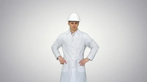 A young engineer putting dafety hat on on gradient background. Stock-Footage 130705552