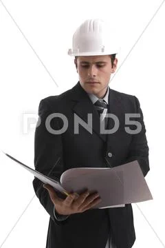 Young engineer, reading a plan Stock Photos