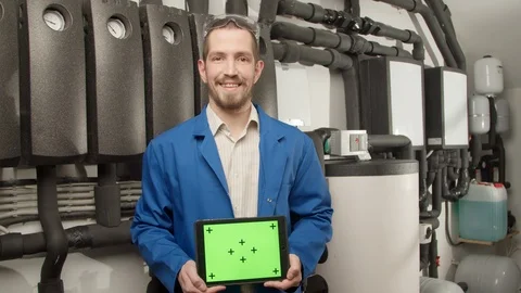 Young engineer smiling at camera with tablet Stock Footage 127171585