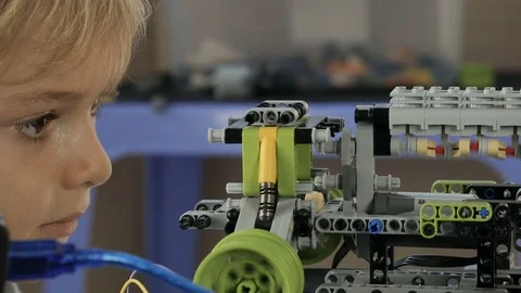 Young engineer studying device of engine. Education concept. Stock Footage 77819853