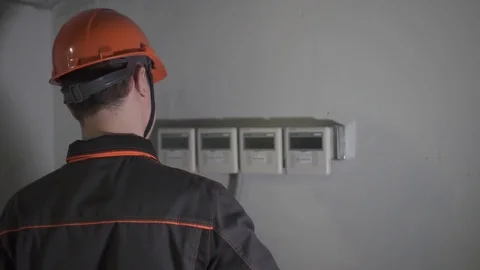 A young engineer is in a technical room. at the factory Stock Footage 105606903