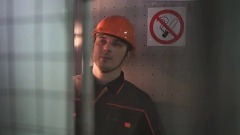 A young engineer is in a technical room. at the factory. no smoke Stock Footage 105606994