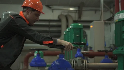 A young engineer is in a technical room. at the factory Stock Footage 105607167