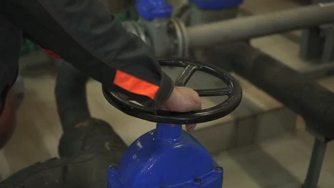A young engineer is in a technical room. at the factory Stock Footage 105607179