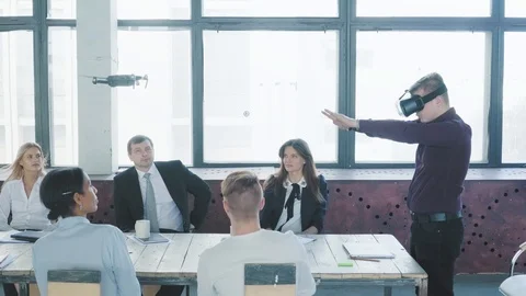 A young engineer is testing a new technology with the team - managing the drone Stock Footage 108187110
