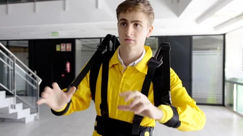 Young engineer trying exoskeleton for ergonomic purpose Stock-Footage 256781839