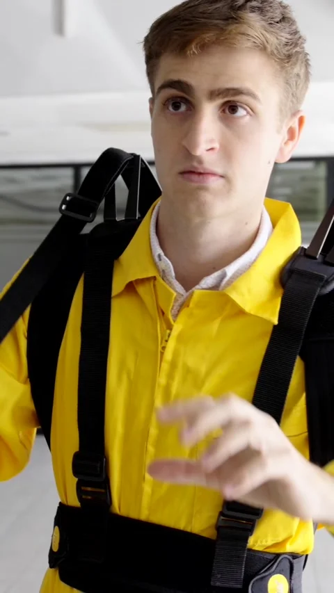 Young engineer trying exoskeleton for ergonomic purpose Stock Footage 258302388