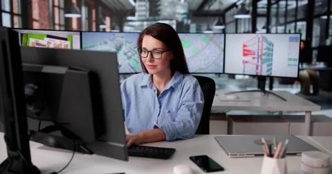 Young Engineer Using GIS Software For Construction Inspection On Desktop Comp Stock Photos