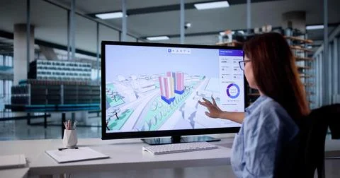 Young Engineer Using GIS Software For Construction Inspection On Desktop Comp Stock Photos