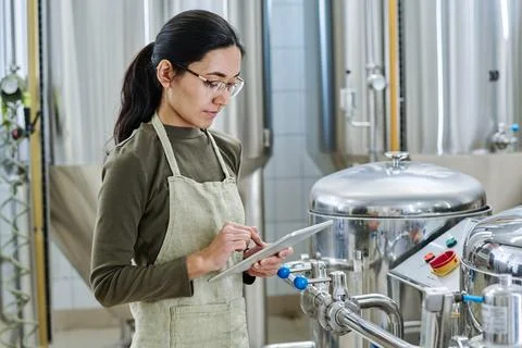 Young engineer using tablet pc at her work Stock Photos