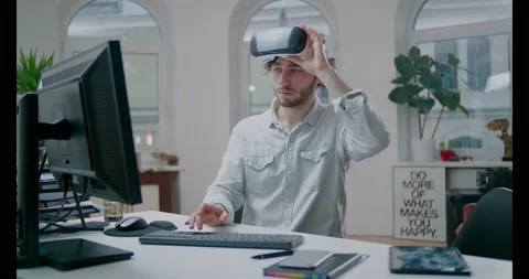 Young Engineer Wearing VR Headset Designs Engine at Modern Office. Stockbeeldmateriaal 134783613