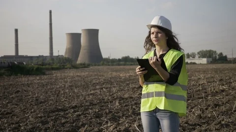 Young engineer woman in charge with work safety inspecting on site constructi Stock Footage 82177585