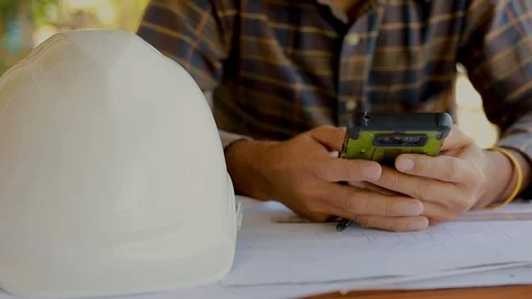 Young engineer working and use a smartphone on his plane project Stock Footage 121600416