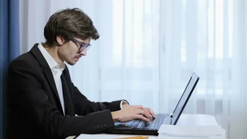 Young engineer working behind laptop in office Video stock 85602048