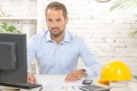Young engineer working on his computer Stock Photos