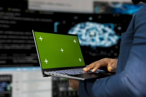 Young engineer works on binary code with copy space on laptop 스톡 사진