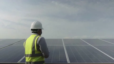 Young engineering working in the power station solar panel Stock Footage 173365547