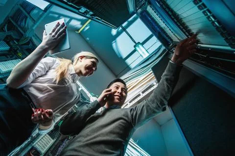 Young engineers businessmen in server room Foto stock