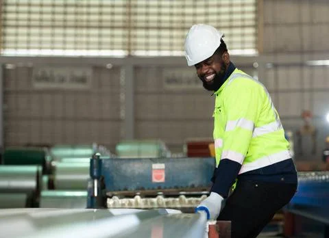 Young engineers engineers testing and confirming that the machinery at the... Stock Photos