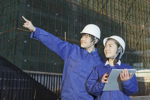The Young Engineers working at construction field Stock Photos