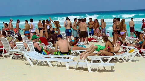 Young enjoying the beach in Spring Break Stock Footage 47754933