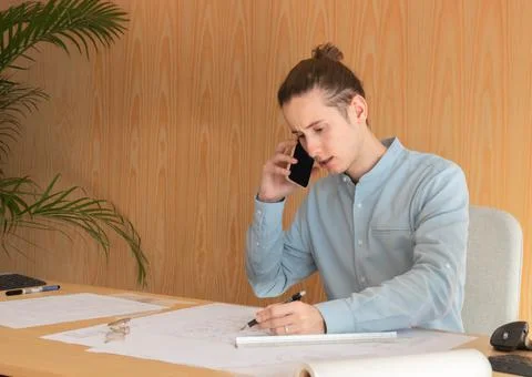 Young enterprising man pulling and loyalty to customers Stockfoto's