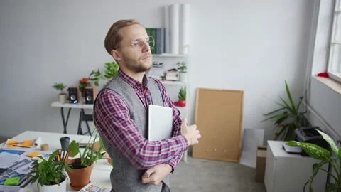 Young entrepreneur choosing application interface Stock Footage 142528330