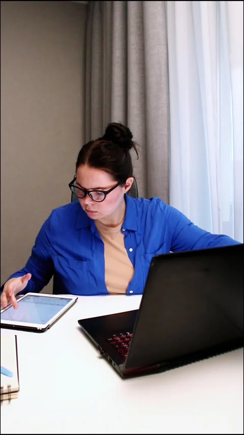 Young entrepreneur developing startup business plan at home. Determined woman Stock Footage 328370733