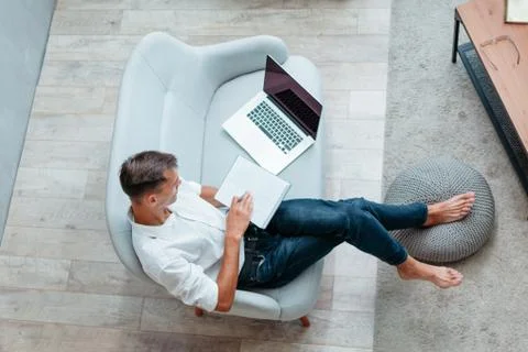 Young entrepreneur making notes in a notebook. Stock Photos