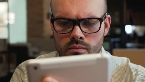 Young entrepreneur or freelancer with PC tablet in office Stock Footage 73048421