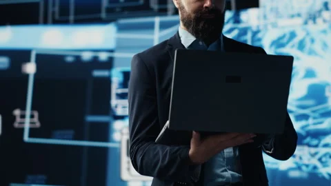 Young entrepreneur reviewing predictive analytics and machine learning Stock Footage 310968220