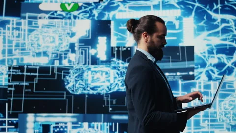 Young entrepreneur reviewing predictive analytics and machine learning Stock Footage 311085632