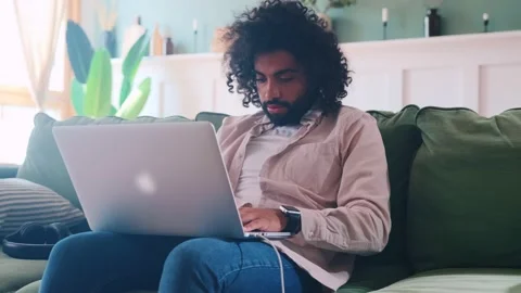 Young ethnic Arabian man programmer does work from home typing code on laptop Video stock 202114255