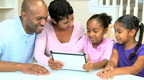 Young Ethnic Family Using Wireless Tablet  Stock Footage 8989999
