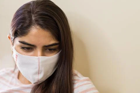 A Young ethnic latin american in a medical mask Stock Photos