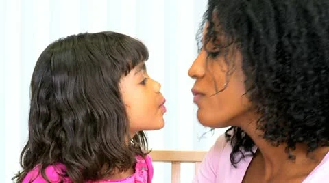 Young Ethnic Mom Daughter Using Lipstick Stock Footage